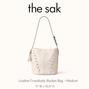 The Sak Cream Leather Crossbody Bucket Bag Tassel Minimalist Adjustable Strap